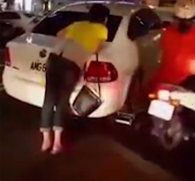 Βίντεο: Απελπισμένη γυναίκα προσπαθεί να σταματήσει το γερανό που της έχει πάρει το αυτοκίνητο 
