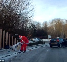 Απίθανο βίντεο: Δείτε πως ένας άνδρας ντυμένος Άγιος Βασίλης "σώζει" μια γυναίκα 