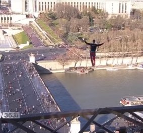 Απίστευτες εικόνες: Περπάτησε σε τεντωμένο σκοινί πάνω από το Παρίσι (ΒΙΝΤΕΟ)
