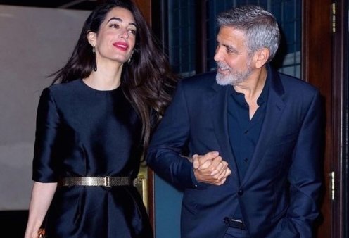 Power couple ο George & η Amal Clooney! Χεράκι-χεράκι με αξεπέραστο στυλ - Ολόσωμη φόρμα για εκείνη, navy blue κοστούμι για εκείνον (φωτό)