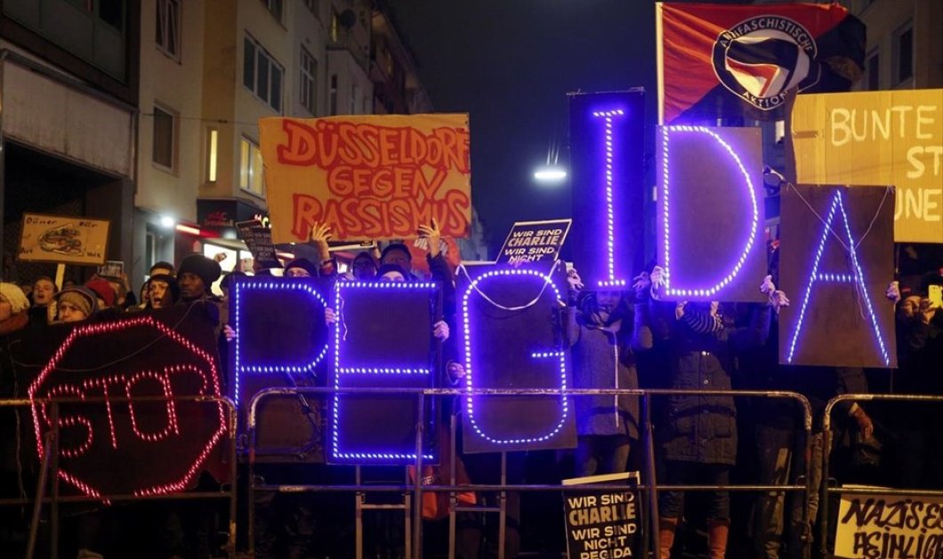 13/1/2015 - Στιγμιότυπο από διαδήλωση στο Ντίσελντορφ της Γερμανίας ενάντια στον ρατσισμό και την ξενοφοβία! REUTERS / INA FASSBENDER