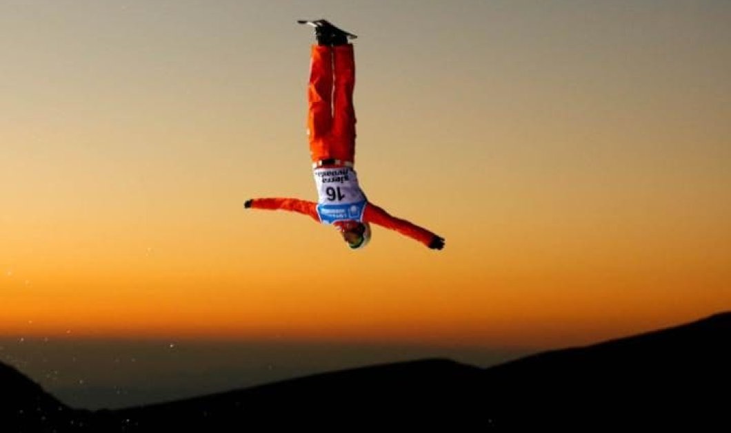 Απίθανος αθλητής κάνει ανάποδη φιγούρα στο Snowboard στην Ισπανία - Picture: PAUL HANNA/ REUTERS