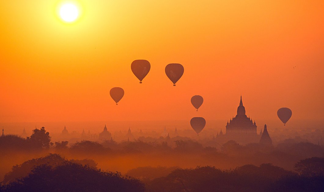 Χιλιάδες ναοί  σε ένα ιδανικό σκηνικό με αερόστατα στην ανατολή του ηλίου στο Μιανμάρ - Picture: Julia Wimmerlin/Solent News