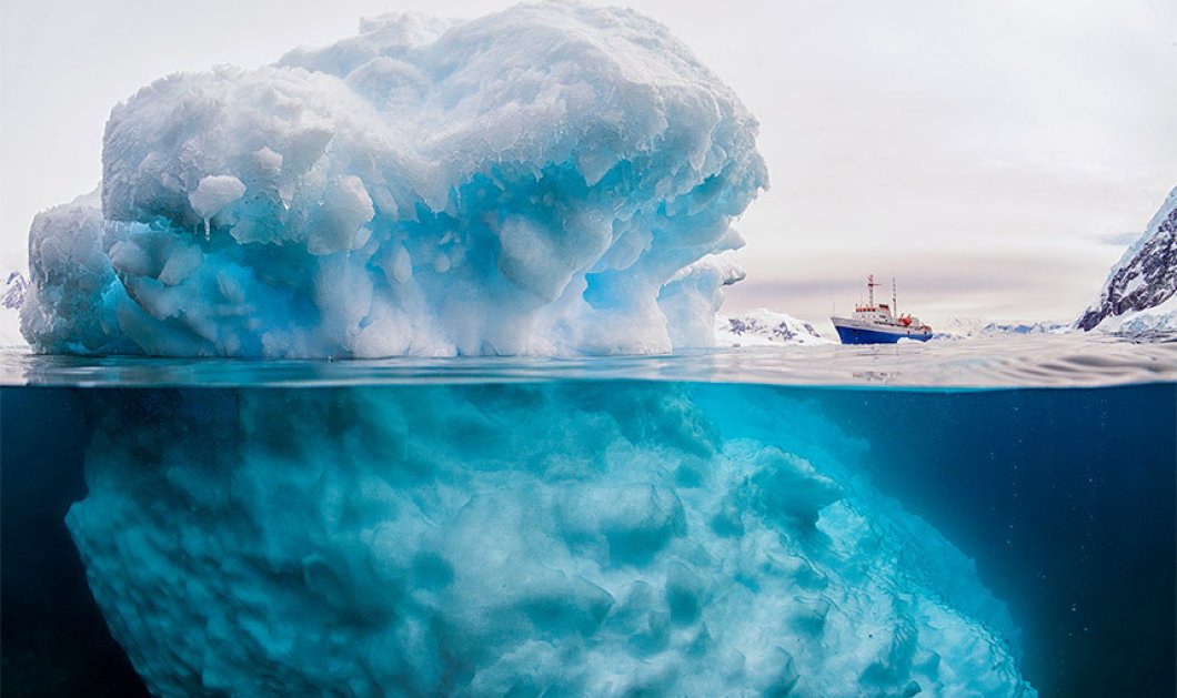 Μπροστά στο γιγαντιαίο παγόβουνο δείχνει "νάνος" το πλοίο - Αν και πραγματικότητα μοιάζει με ψευδαίσθηση - Picture: Rick Du Boisson/Solent News & Photo Agency
